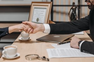 lawyer shaking hands with a client