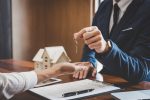 Real estate lawyer handing out keys