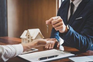 Real estate lawyer handing out keys