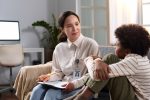 Forensic Social Worker Talking to Young Boy