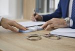 Man gives some money to a bondsman asking to release someone from prison on bail
