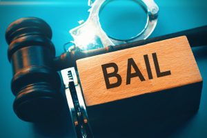 Conceptual photo showing an agreement by a criminal defendant to appear for trial or pay a sum of money set by the court