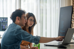 Visualize the synergy of men and women in tech, transforming ideas into reality, as they merge their skills in coding, and e-commerce for groundbreaking results.