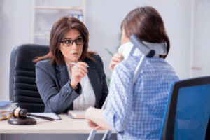 Personal injury lawyer in a meeting with her client