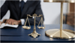a lawyer's office or a courtroom, focusing on the scales of justice.