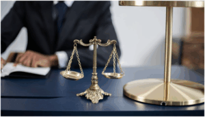 a lawyer's office or a courtroom, focusing on the scales of justice.