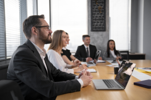 a group of professionals in a corporate boardroom meeting
