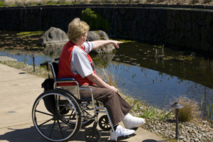Older woman in a wheel chair at the park