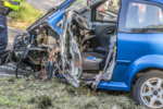 Close-Up Of Damaged Car At Roadside