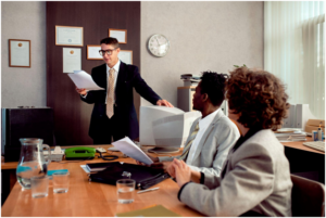 multi-ethnic team of coworkers discussing corporate plans
