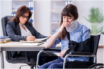 a person in a wheelchair consulting with a professional