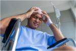 Person experiencing physical discomfort while receiving care in a medical setting
