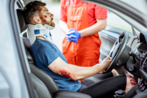 Injured man on the driver seat after the accident