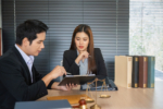 Legal Consultation and Document Review. Professionals discussing legal matters in an office environment.