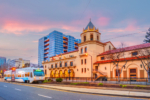 Light rail train and downtown San Jose city skyline in Silicon Valley in California