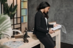 Professional working in an office environment while reviewing paperwork