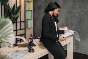 Professional working in an office environment while reviewing paperwork