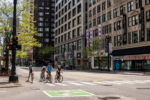 Chicago, IL / USA - May 24,2020: A group of bicyclists stop at a stop light downtown, in the Loop.