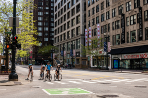 Chicago, IL / USA - May 24,2020: A group of bicyclists stop at a stop light downtown, in the Loop.