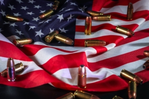 Ammunition cartridges scattered across the United States flag